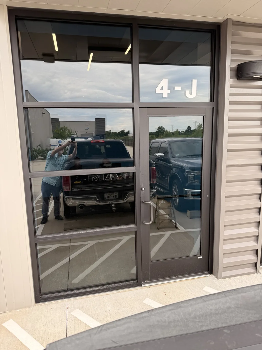 Blank commercial storefront before Workhorse Branding window graphics installation